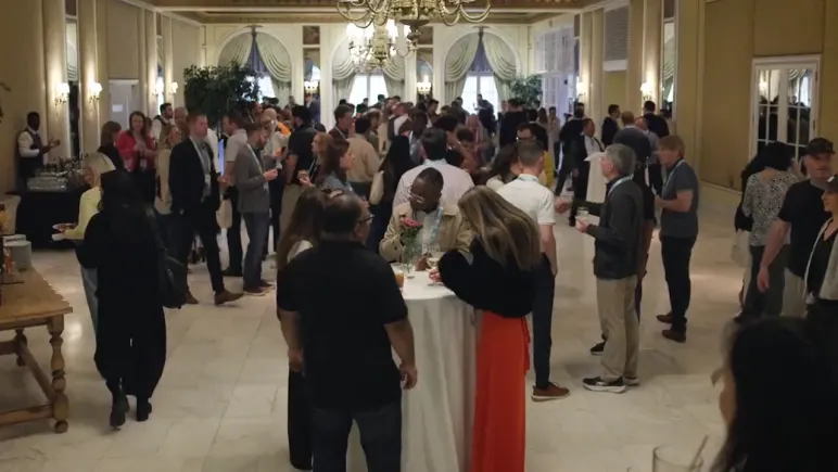 Attendees at the welcome reception in the ballroom