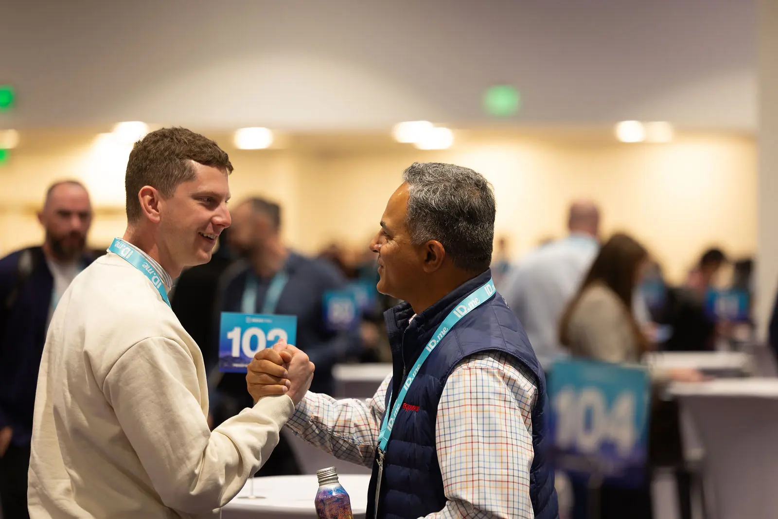 Two practitioners greeting each other on the Breakthru meeting floor