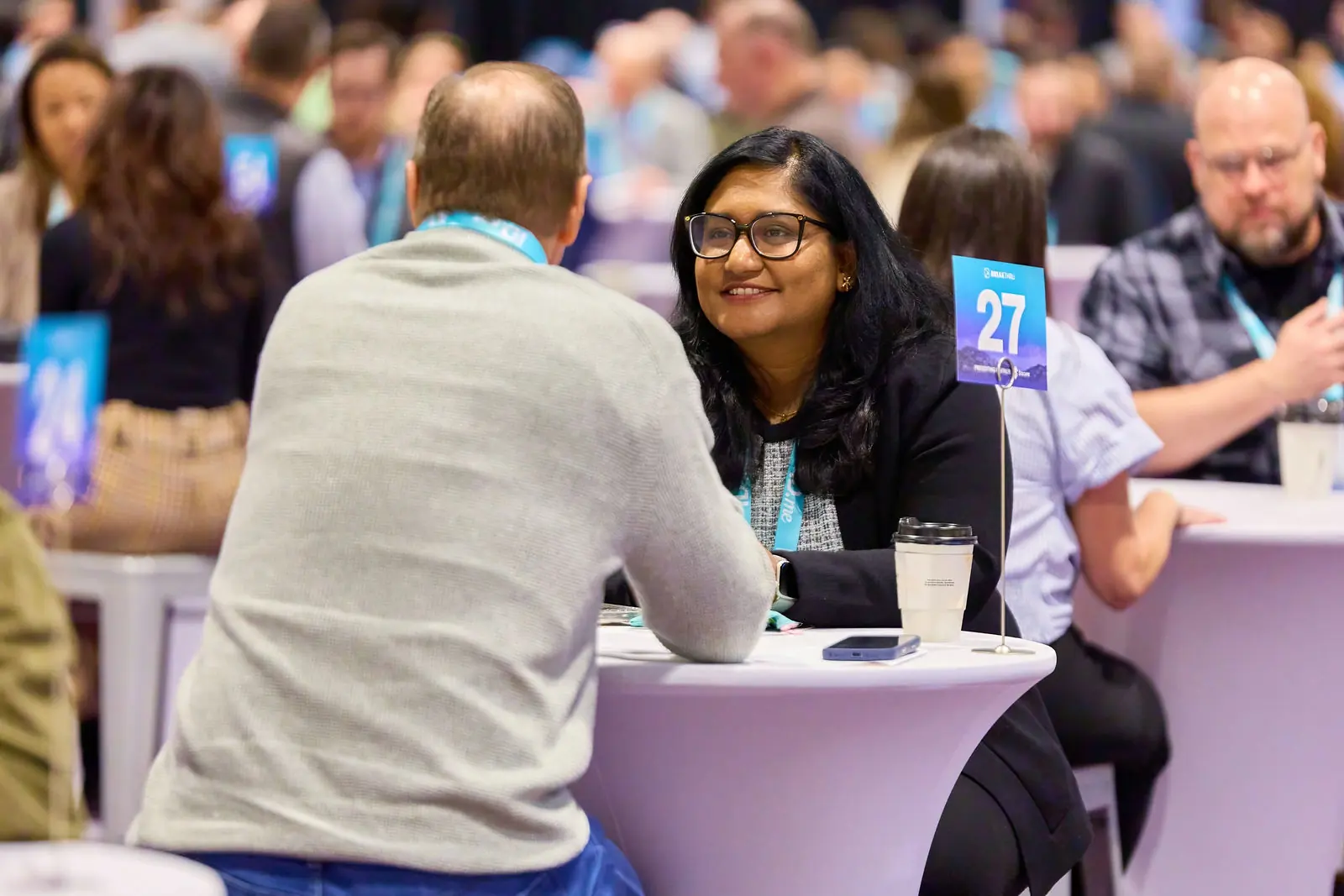 Two practitioners in a pre-scheduled 1:1 at a numbered Breakthru table