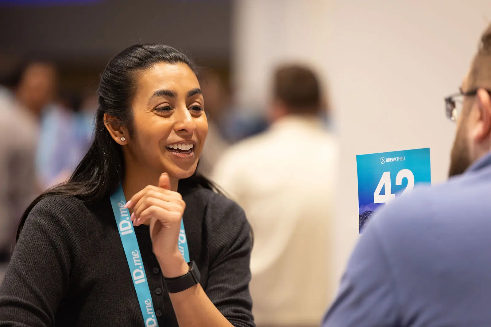 A practitioner smiling during a hallway conversation