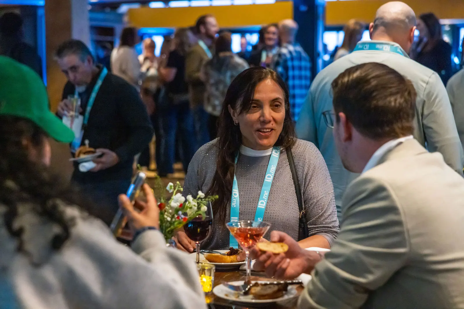 A guest smiling at a networking dinner