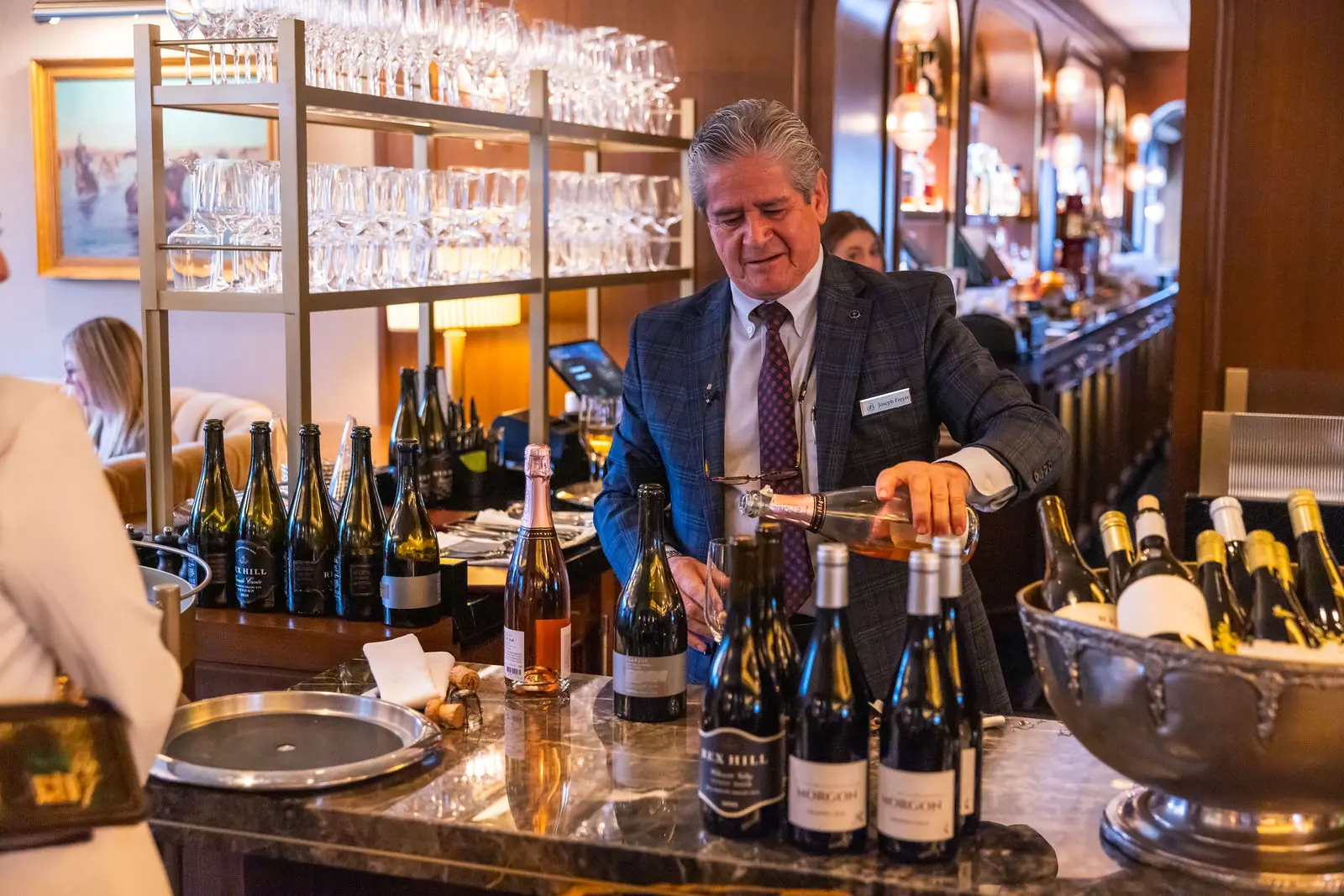 Wine being poured at a Breakthru networking dinner