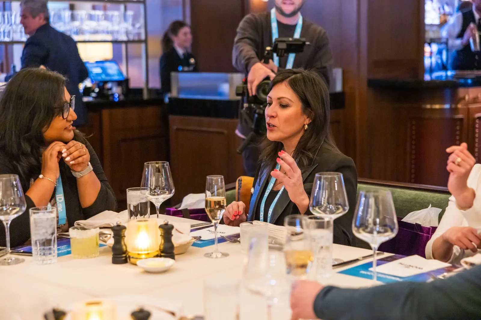 A guest speaking at a networking dinner table