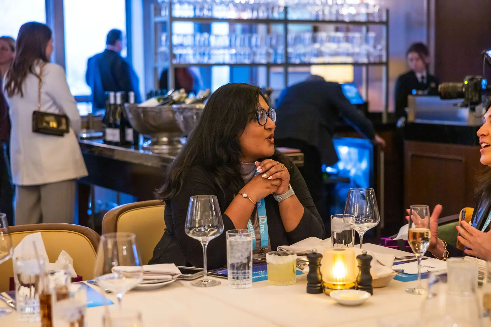 Two guests talking over dinner