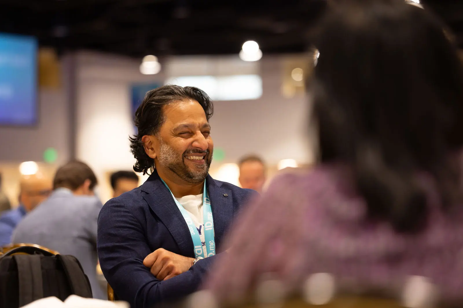 An attendee laughing between sessions