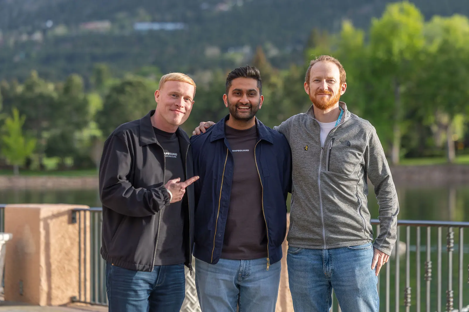 Three attendees together beside the Broadmoor lake