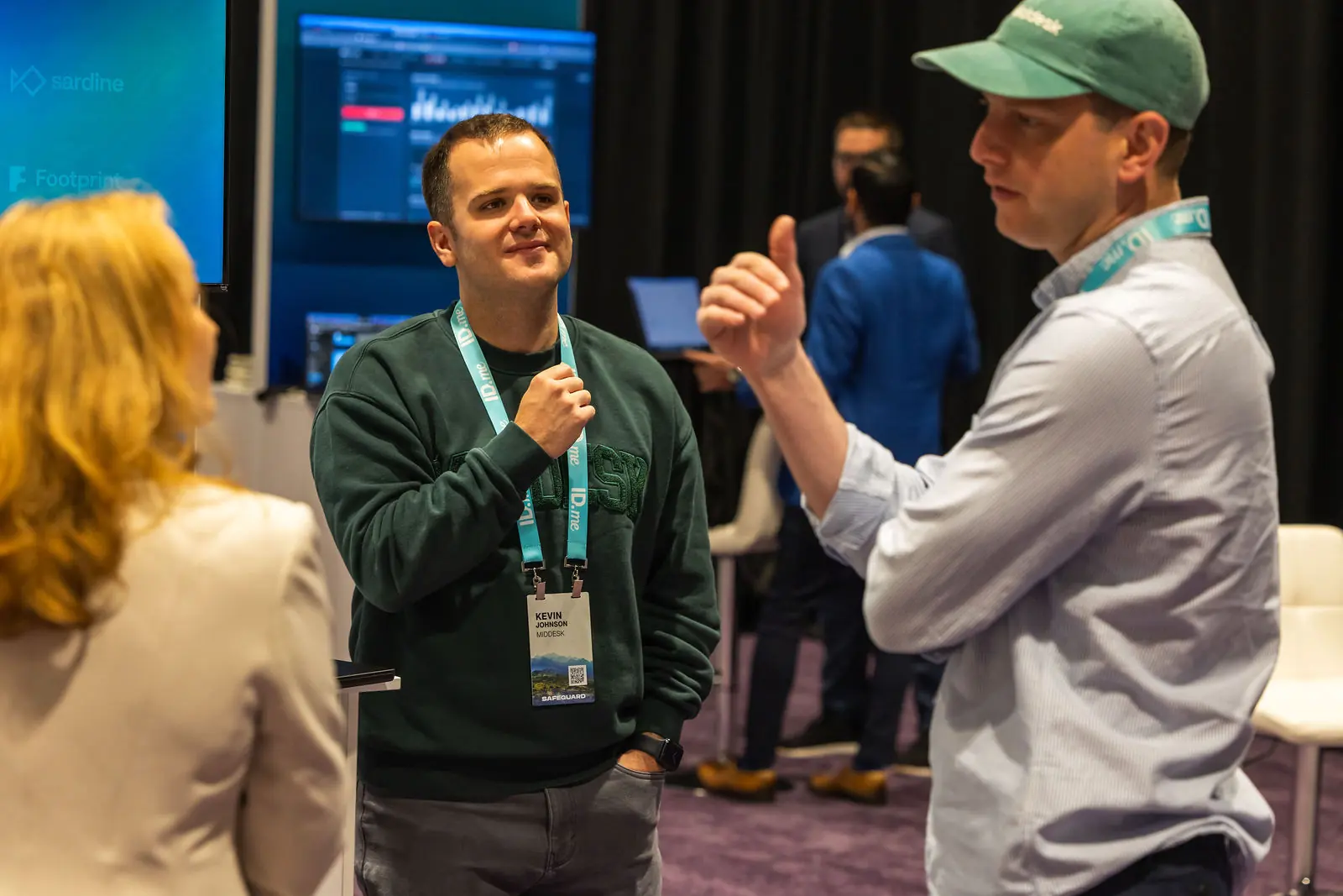 An attendee mid-gesture in a small networking group