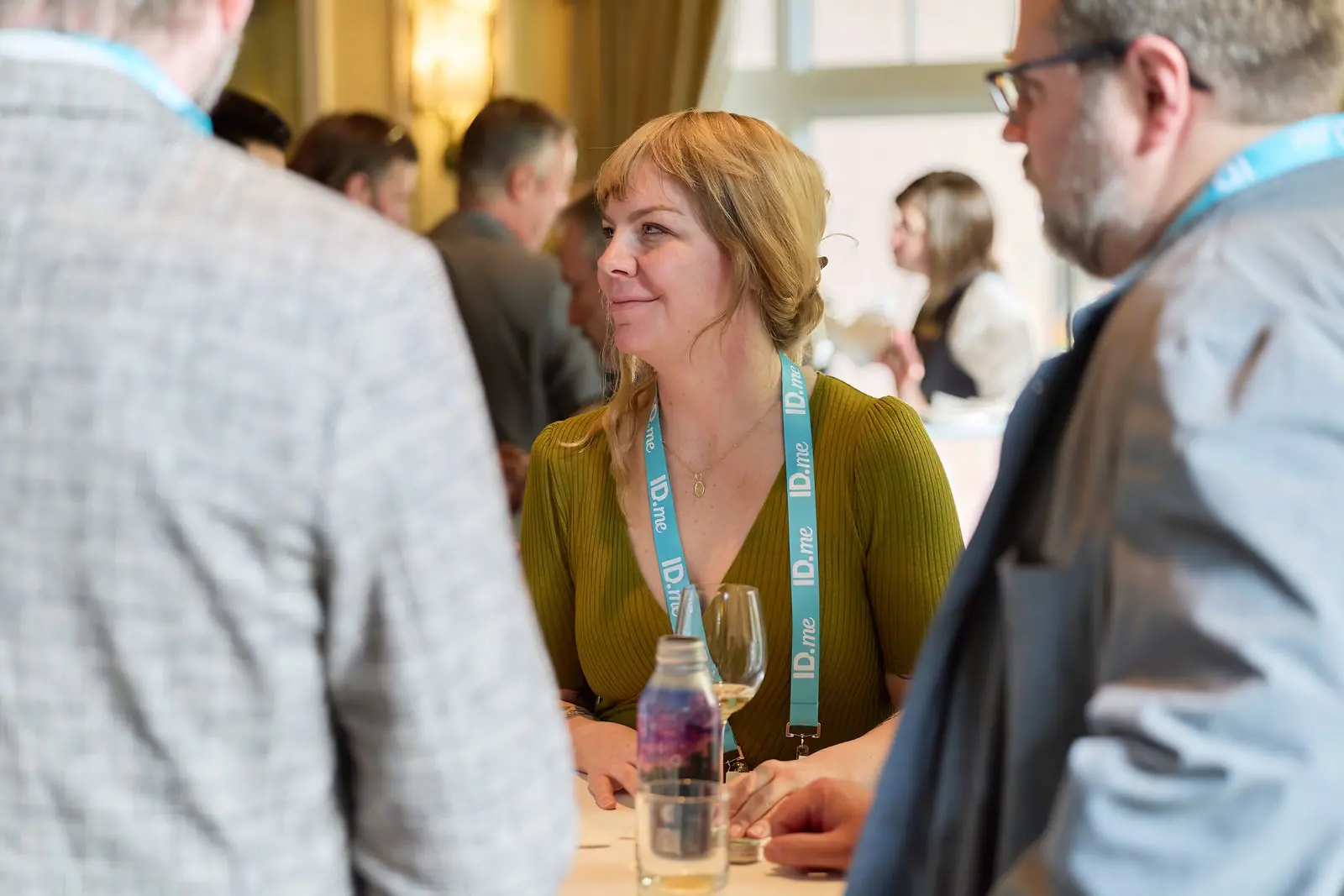 A practitioner mid-conversation at the opening reception