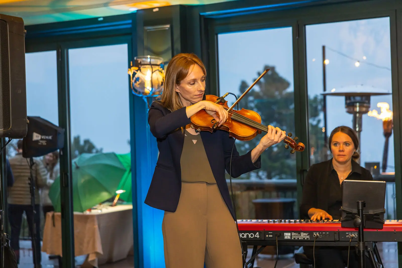 A violinist playing at the closing reception