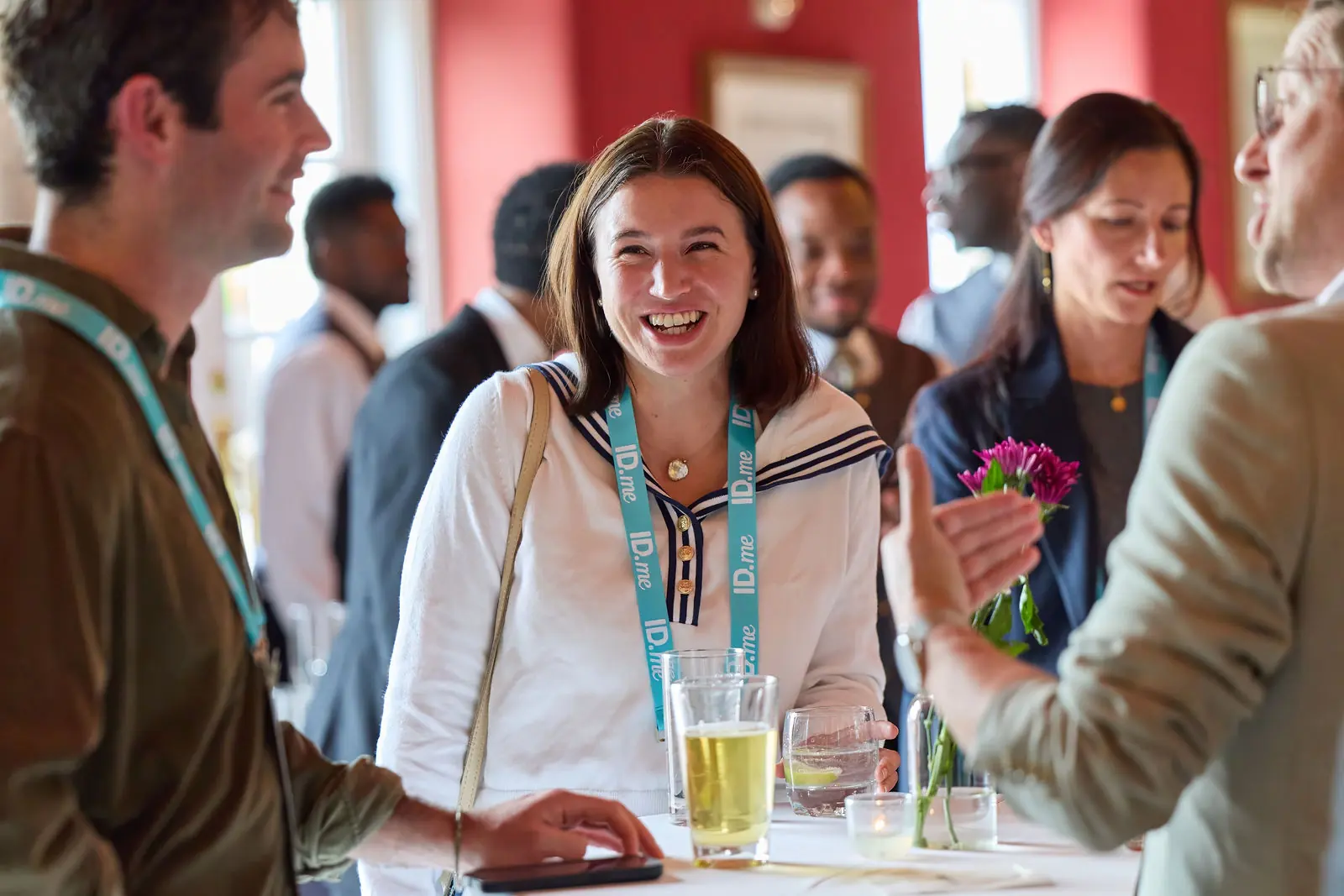 An attendee smiling during a reception conversation