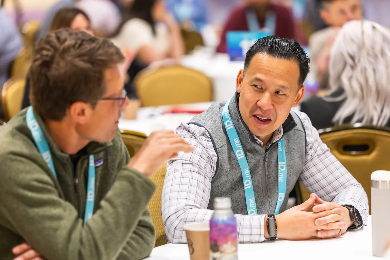 Two practitioners in conversation at a roundtable