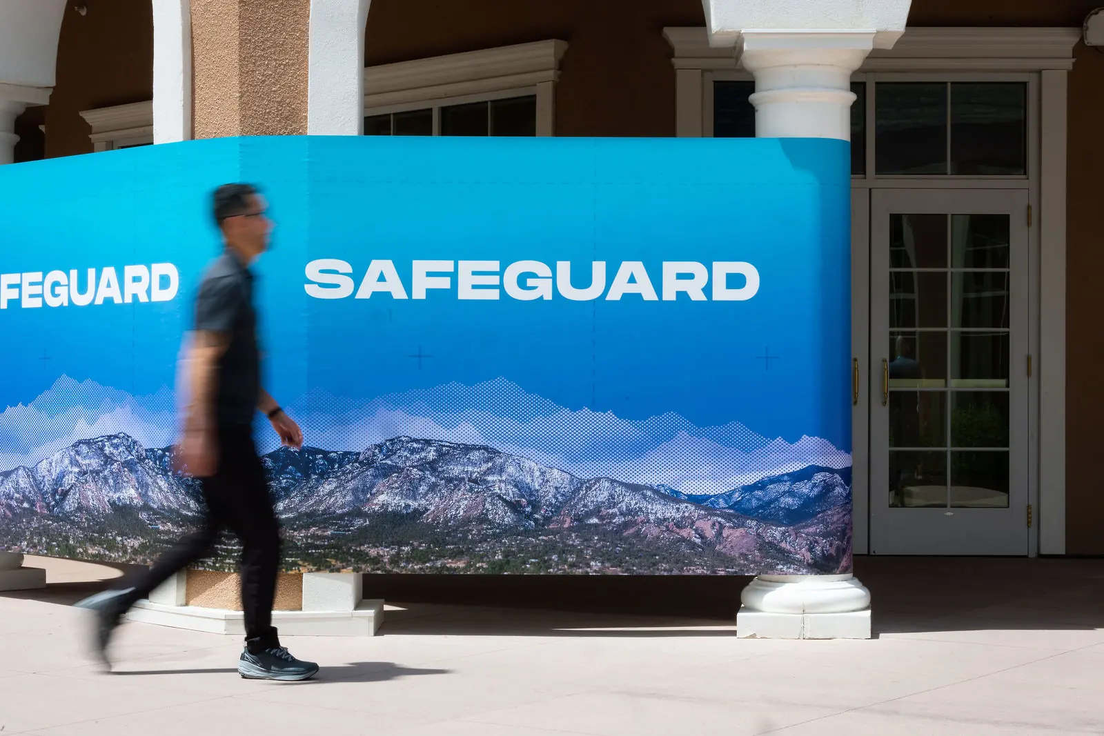 The Safeguard branded wall at the entrance to the meeting hall