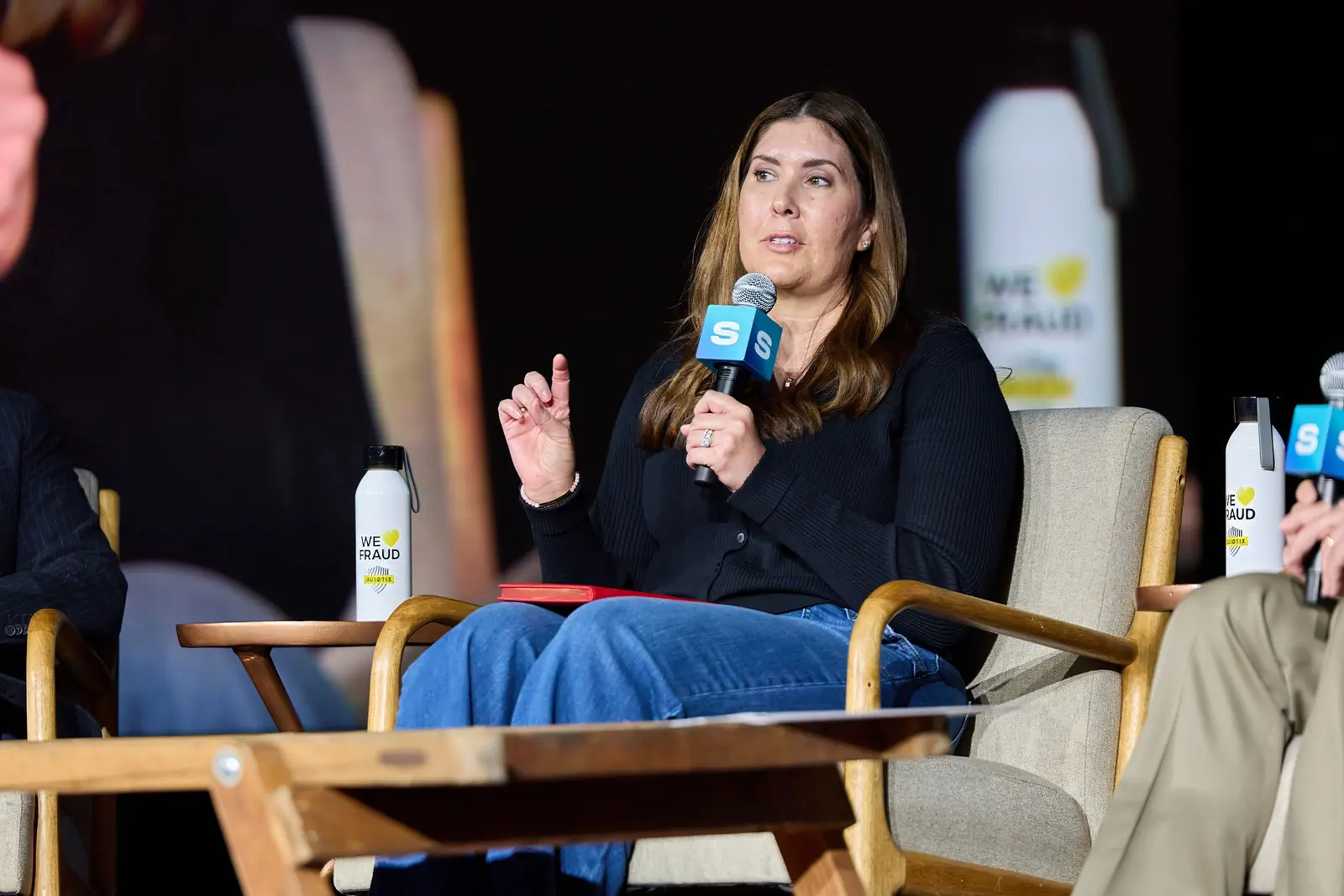 A speaker taking a question from the stage