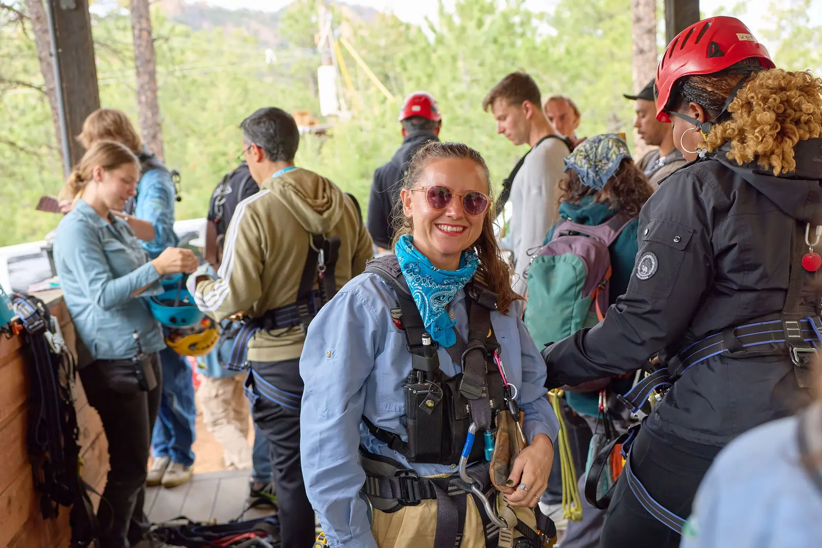 A group of attendees geared up for the zipline experience