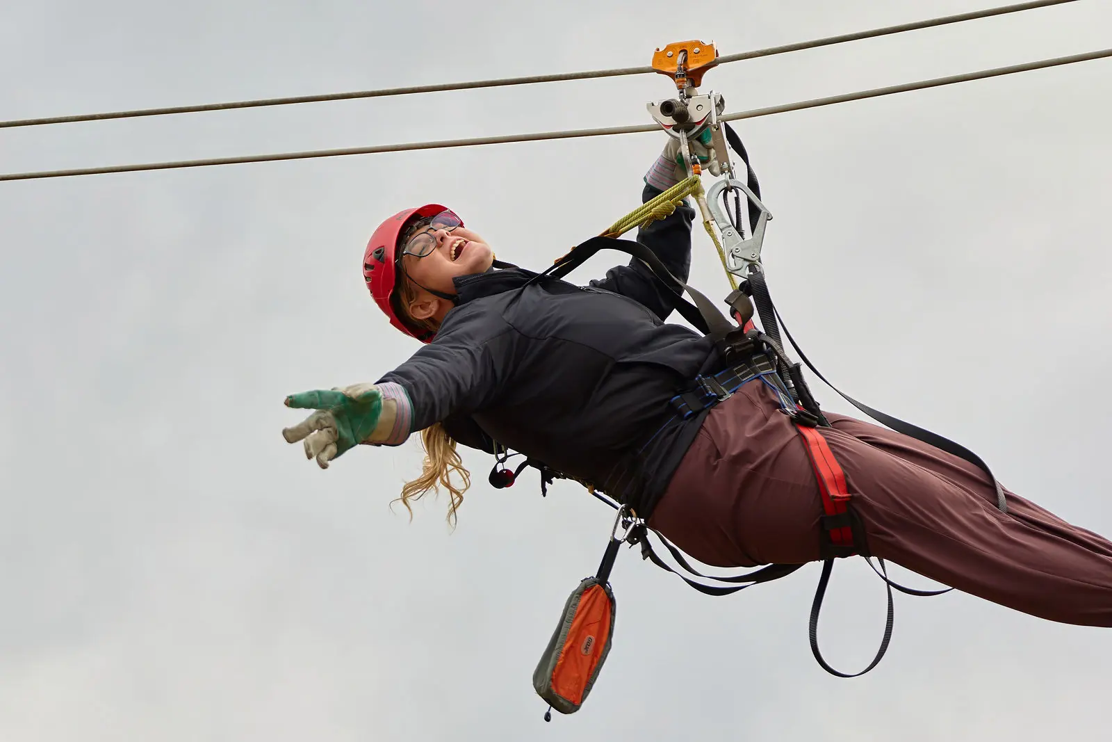 An attendee flying the zipline course above Colorado Springs